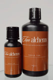 Two bottles of Tan Alchemy Rapid Tan on a white background