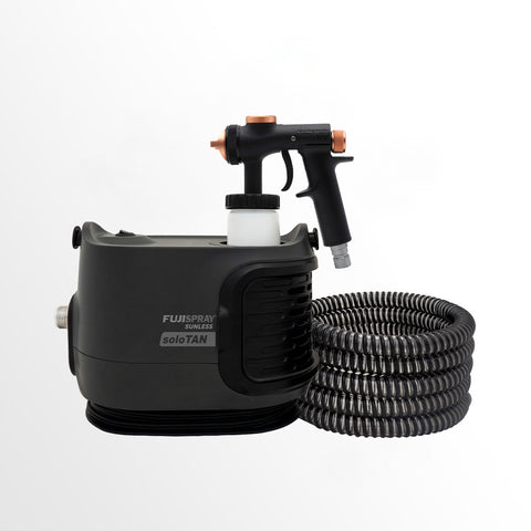 Black spray gun with hose on a white background