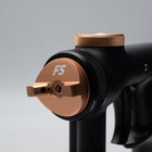 Black and copper spray gun nozzle with 'FS' branding on a gray background