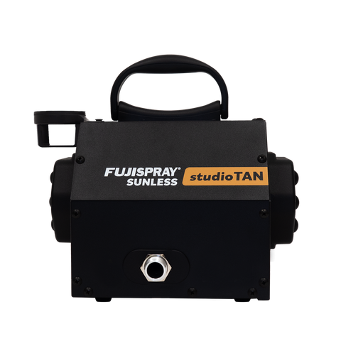 Black tanning machine with Fujispray and studioTAN branding on a white background