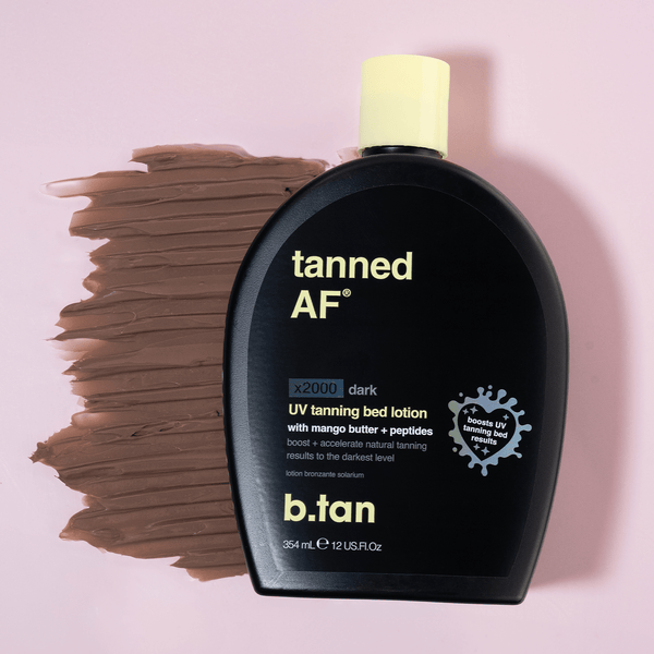b.tan tanned AF UV tanning bed lotion bottle with a swatch of brown color on a pink background