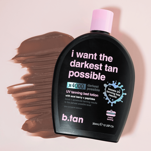 Bottle of b.tan tanning bed lotion with a swatch of brown color on a light pink background