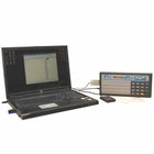 Laptop with a screen displaying software interface and a device labeled 'Laser Manager Pro' on a white background