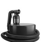 A pro handheld spray tan machine with coiled hose by MineTan.