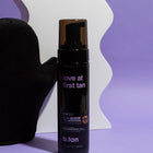 B.tan self-tanning product with a black pump on a purple background