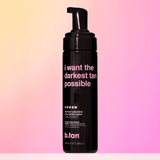 Black bottle of b.tan with pink text on a gradient background