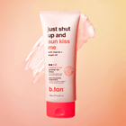 b.tan gradual tan lotion tube on a peach background