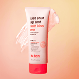 b.tan gradual tan lotion tube on a peach background