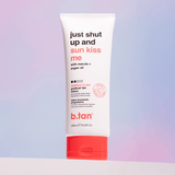 Tube of b.tan tanning lotion with red and white design on a gradient background