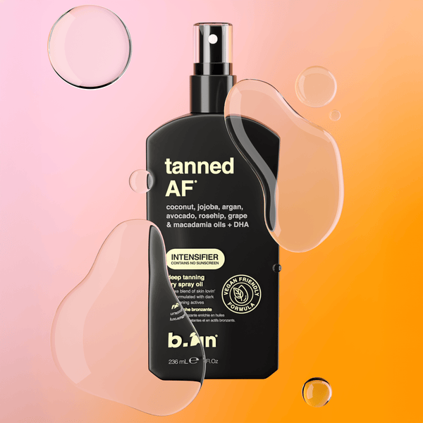 B.TAN 'tanned AF' intensifier spray bottle on a gradient pink to orange background