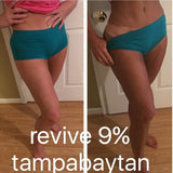 Person wearing teal shorts with text 'revive 9% tampabaytan' on a wooden floor.
