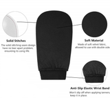 Black tanning mitt with text highlighting solid stitches, soft material, and anti-slip elastic wrist band on a white background.