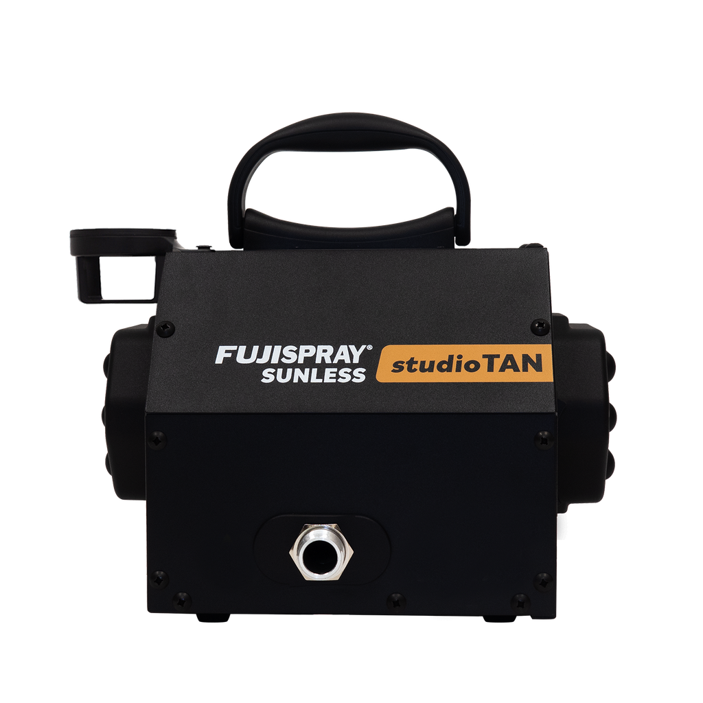 Black tanning machine with Fujispray and studioTAN branding on a white background