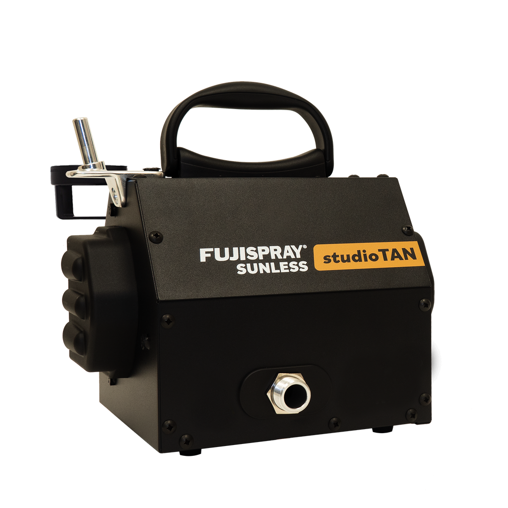 Black tanning machine with 'Fujispray Sunless Studio Tan' branding on a white background